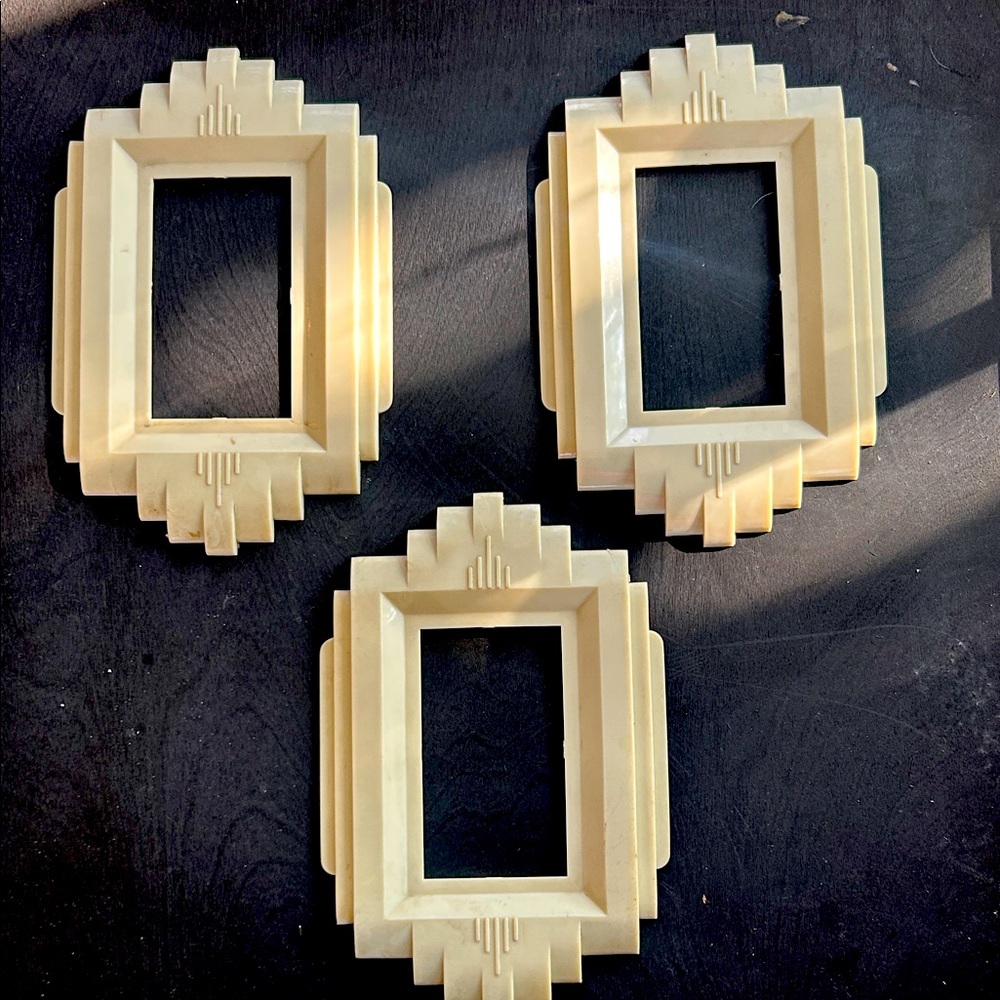 3 Vintage Cream Art Deco light switch plates. Very good condition.